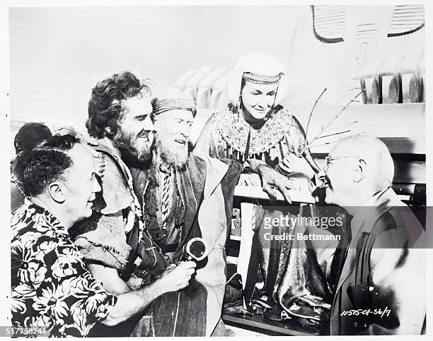 Here's an interesting informal closeup on the set of Cecil B. DeMille's production of The Ten Commandments showing, from left to right, Peverell...