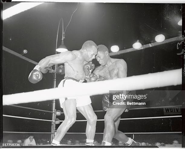 Few seconds after Ezzard Charles got in an an uppercut during the third round Jersey Joe Walcott came back landing a knee buckling right on the champ...