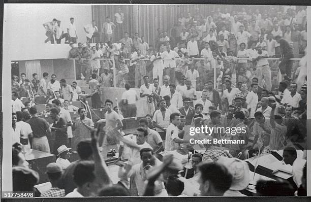 Scores of "hunger marchers" swarm onto the floor of the National Assembly here, Oct.5th, from their seats in the public gallery after the assembly...