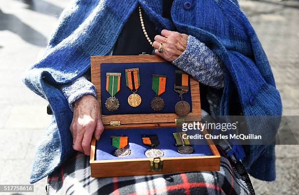 Shelia O'Leary, aged 94 is pictured with her father, Thomas Francis Byrne's medals which he earned for bravery and injuries sustained during the...