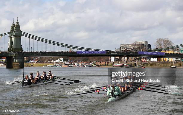 The Oxford boat leads the Cambridge boat as they approach Hammersmith Bridge during The Cancer Research UK Women's Boat Race on March 27, 2016 in...