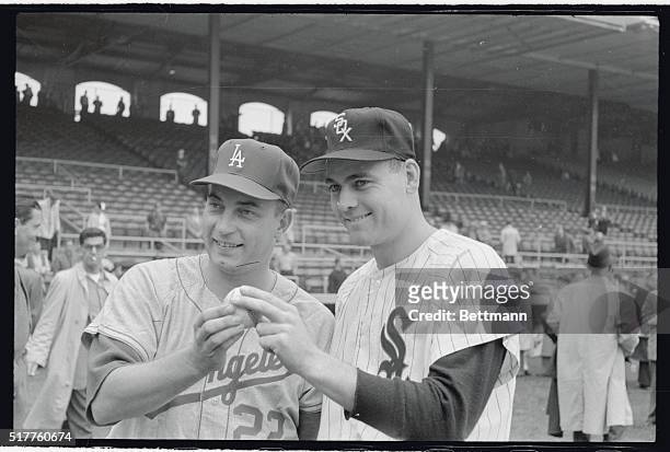 Johnny Podres of L.A. Dodgers, and Bob Shaw of White Sox, starting pitchers for the 2nd game of World Series here 10/2, grip a ball for photographers...