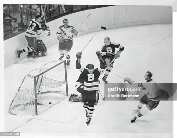 Chalk one up for Don Raleigh of the Rangers as he tallies in the first period against the Boston Bruins at Madison Square Garden. Danny Lewicki lent...