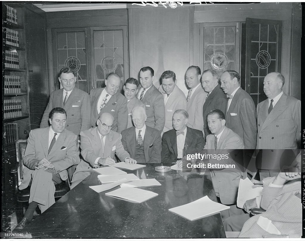 Businessmen Signing an Agreement