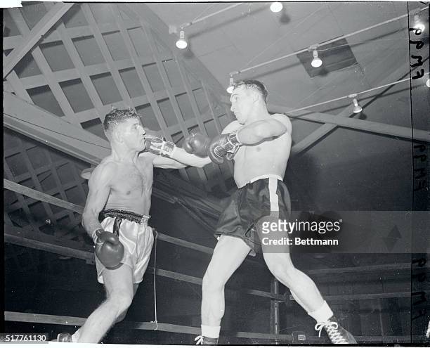 Gene Fullmer scores with a left to the head of Peter Mueller, German middleweight in the second round of their ten rounder at the Eastern Parkway...