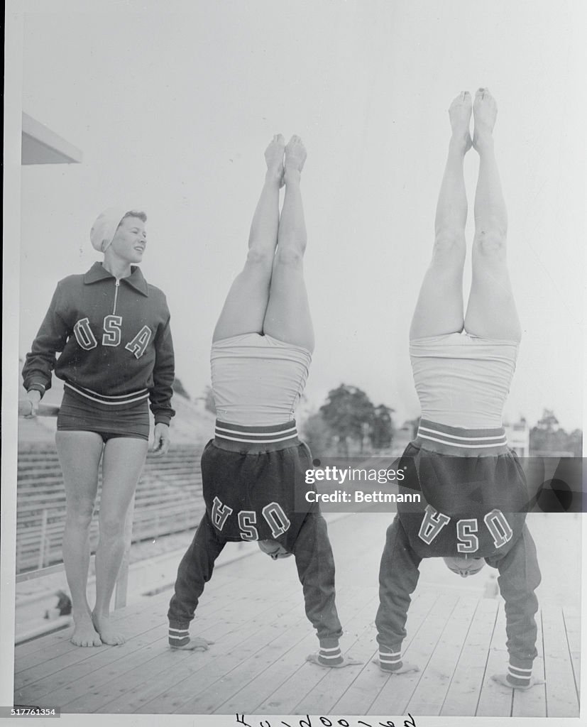 Olympic Divers Performing Handstands