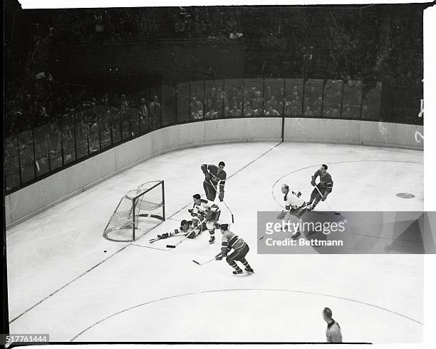 Montreal Canadiens' Bernie Geoffrion sees his attempt to score thwarted by New York Rangers' goalie Lorne Worsley in the second period of tonight's...