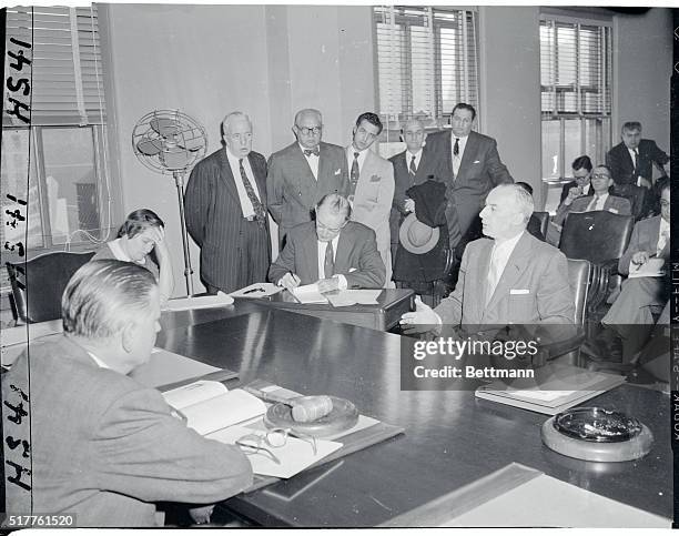 Boxing Commissioner Robert Christenberry listens intently as Ray Arcel, promoter of Saturday night television boxing bouts, testifies at the New York...
