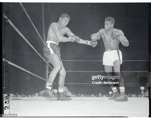 Willie Troy tries to stave off the drive of Brooklyn's hard punching middleweight Floyd Patterson in the third round of their bout at the Garden...