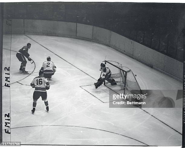 Marty Pavelich of the Detroit Red Wings sees his score tieing goal get past New York Ranges' goalie, Lorne Worsley, in the third period of tonight's...