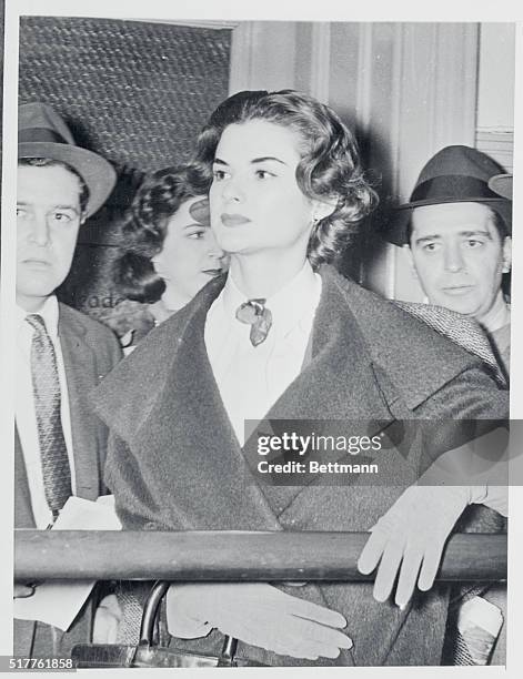 Model Dorothea McCarthy is shown at the East 67th St. Police station where she was questioned in connection with the mysterious slaying of financier...