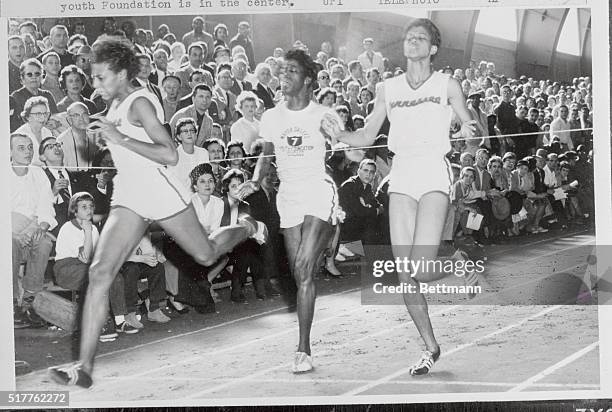 Vivian Brown, left, of Tennessee State won the 220 yard in the National AAU Womens Track Championships beating out team mate Wilma Rudolph, right,...