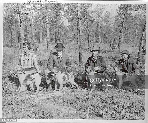 Winners of the first floor places in the all-age stake of Old Dominion Brittany Club Annual Field Trials are shown here with handlers or owners. Left...