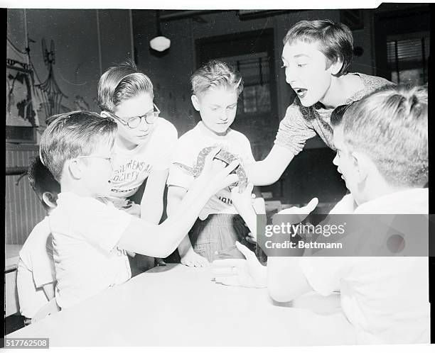 Young William Fleschhauer, one of the campers who were given a nature talk today at the Children's Aid Society is pop-eyed as he holds a hog-nose...