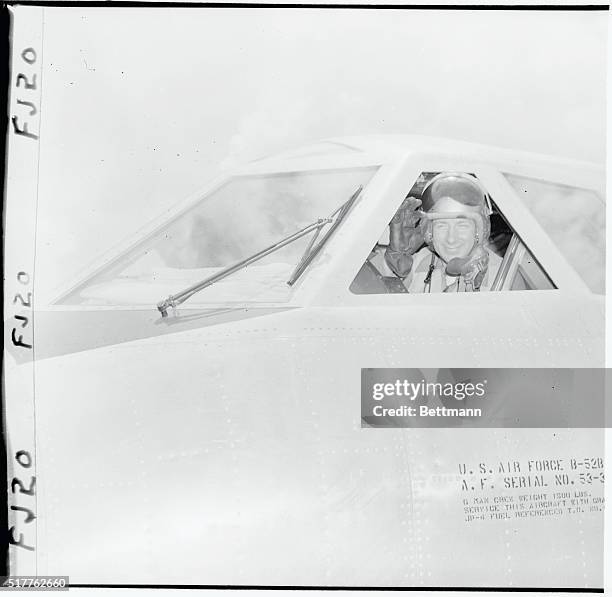 Major David M. Critchlow, of Sacramento, California, gives the "all O.K." sign from the cockpit of the B-52 intercontinental jet bomber from which he...