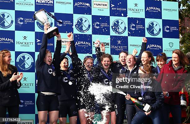 The Oxford crew celebrate with the trophy following their victory during The Cancer Research UK Women's Boat Race on March 27, 2016 in London,...