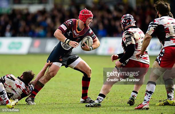 Dragons player Tyler Morgan makes a break during the Guinness Pro 12 match between Newport Gwent Dragons and Edinburgh Rugby at Rodney Parade on...