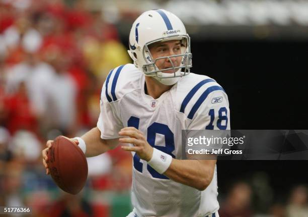 Peyton Manning of the Indianapolis Colts looks to make a pass play during the game against the Kansas City Chiefs at Arrowhead Stadium on October 31,...