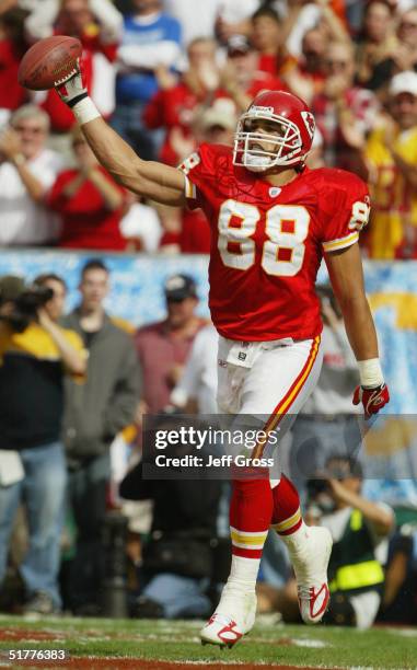 Tony Gonzalez of the Kansas City Chiefs holds out the ball in celebration in the end zone during the game against the Indianapolis Colts at Arrowhead...