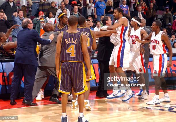 Ron Artest and other members of the Indiana Pacers scuffle with members of the Detroit Pistons during a melee involving fans at a game against the...