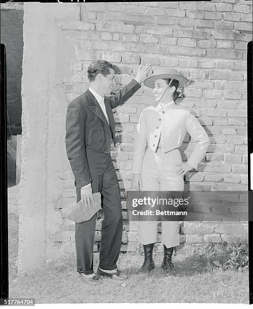 Pretty 26 year old Bertha Trujillo is shown before going into the bull ring to face a ton of savage fury in a contest as old as civilization, man...