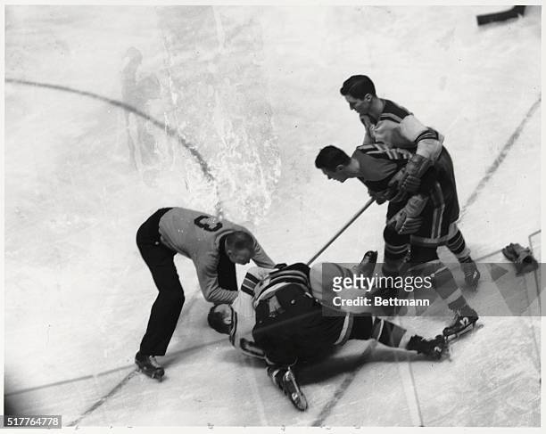 Heat on ice. New York: A fight broke out midway in the first period of tonight's Rangers-Chicago Game at the Garden. Here an official rushes in to...