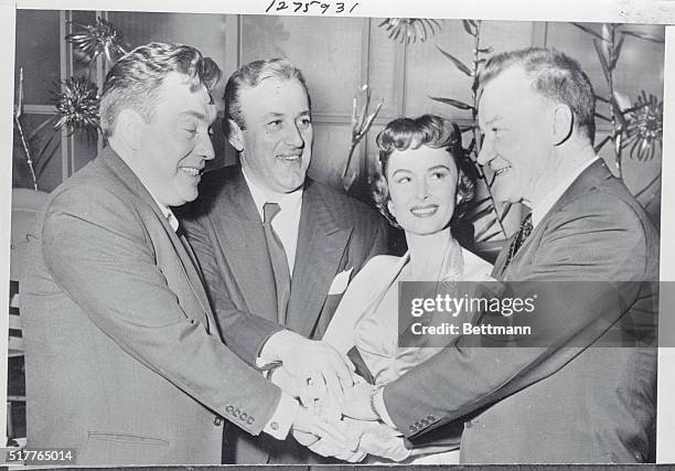 Hollywood, California: A 4 way handshake of joy is joined in by Edmond O'Brien, Lee J. Cobb, Donna Reed and Tom Tully immediately after the men were...