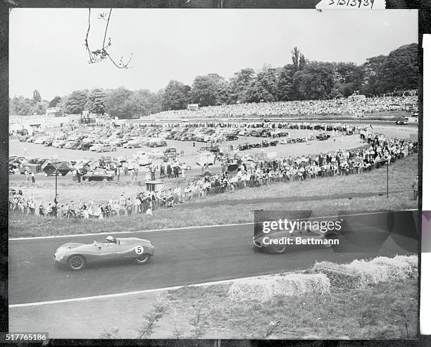 London, England: S. Foreman, , and Stirling Moss, , are fighting it out for the lead here during the Norbury Trophy Race at London's Crystal Palace,...