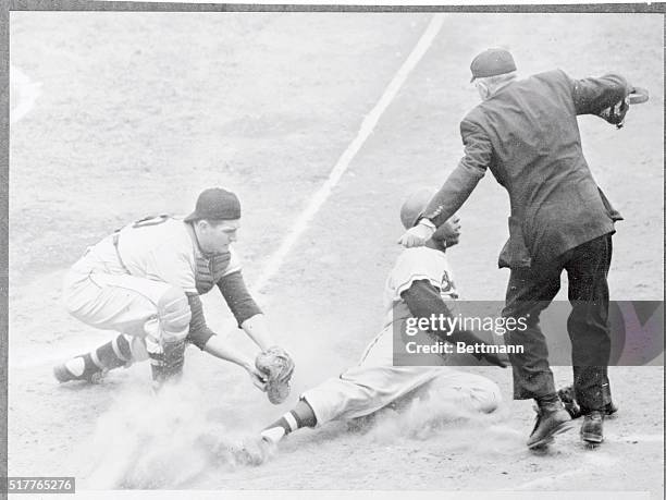 Milwaukee Braves' Hank Aaron being tagged out at plate by Pittsburgh's Jack Shepard as he tried to score from first on double by Bobby Thomson in 7th...