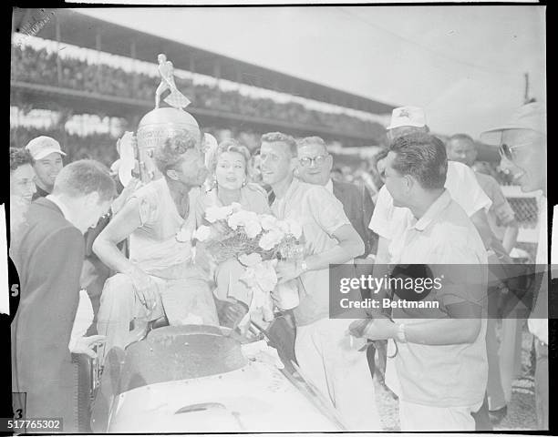 Indianapolis, Indiana: Flaherty Wins Speed Race--Pat Flaherty, , red haired Chicago tavern owner, is about to kiss Queen Virginia Mayo in the...