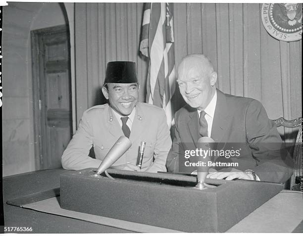 Washington, D.C.: President Eisenhower explains the mechanics of television to President Sukarno of Indonesia as they arrived at the White House...