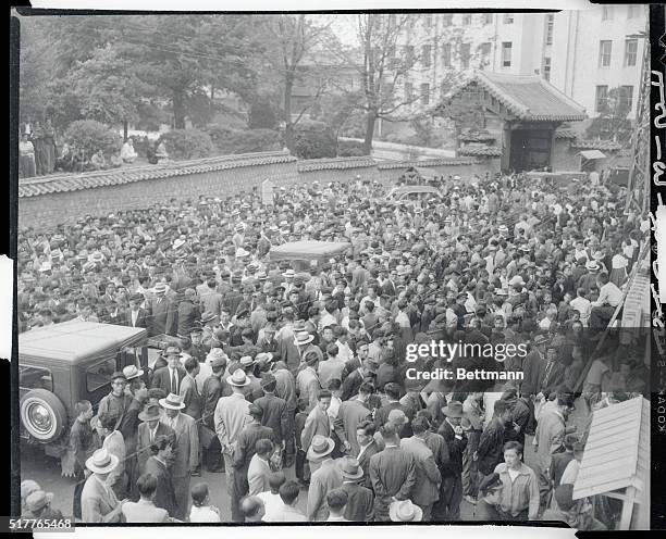 Rhee's running mate concedes defeat. Seoul, Korea: A huge crowd of Koreans are shown gathered in front of the Kyunghang Daily News where a bulletin...