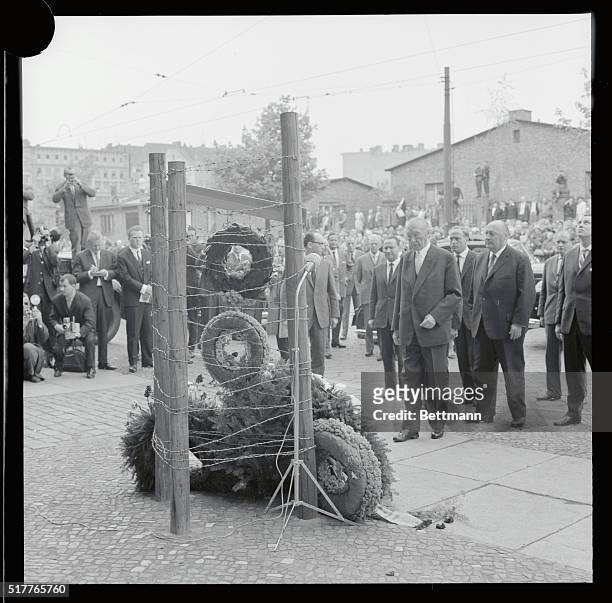 Lays Wreath for Communist Wall Victim. West Berlin, West Germany: West German chancellor Konrad Adenauer stands in front of a stark, wood and barbed...