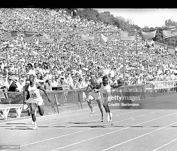 Bob Hayes, US, winning the 100 meter dash with Bob Sayers, US finishing 2nd. The Russians finished third and fourth.
