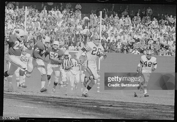 With three cardinals in hot pursuit, the Brown's Ray Renfro runs for a touchdown on a pass from the Browns' Jim Ninowski from 38yd. Out in the fourth...