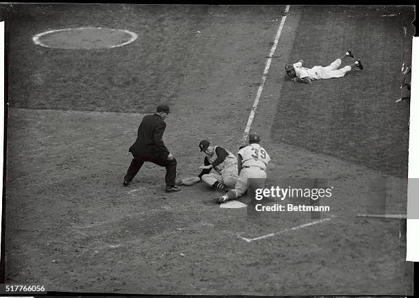 Skinner of the Pittsburgh Pirates is nabbed at home trying to score on Groat's infield grounder to Valdes in the fifth inning of today's game at...