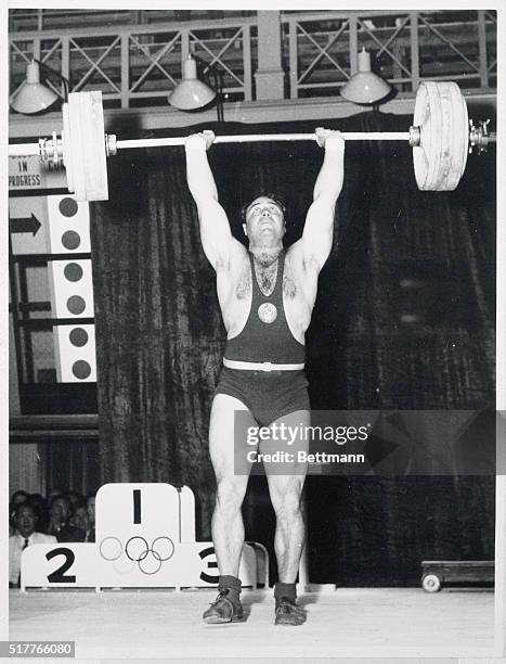 Olympics. The Russian winner of the Middle Heavyweight Weightlifting, Arkadii Voroviev, makes a new world record during event. He smashed world and...