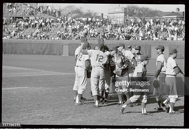 Teammates rush to congratulate Los Angeles Dodgers southpaw Sandy Koufax after he struck out 18 in pitching the Dodgers to 10-2 victory over the...