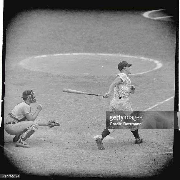 Roger Maris of the Yankees watches as his 56th home run sails into the right - center field bleachers in the seventh inning of the September 9th game...