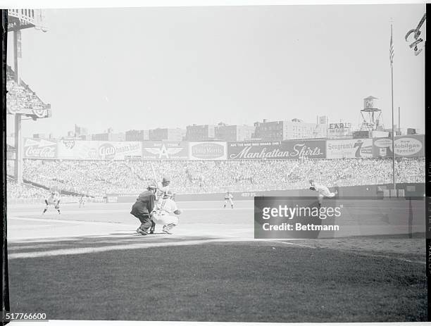 And the Second Game is Underway. New York, New York: Yankee left hander Tommy Bryne hurls the first pitch to Dodger lead off man Junior Gilliam as...