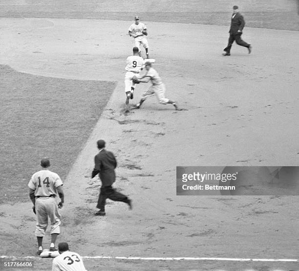 This sequence of photos the first double play of the 1955 World Series, brought off in the first inning of the opener between the Yankees and the...