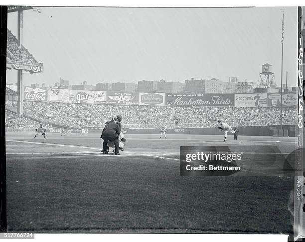 First Pitch of Finale -- a Strike. New York, New York: The first pitch of the seventh and deciding game of the 1955 World Series wings toward the...