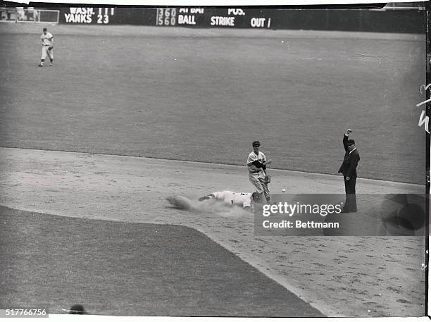 Mantle of the Yankees is forced at second base as Collins grounds into a double play in the third inning of today's game with the Washington...