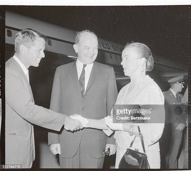 Mrs. Dean Rusk greets Attorney General Robert Kennedy and her husband Secretary of State Dean Rusk .
