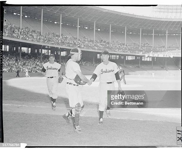 Strikeout King. Cleveland, Ohio: Rookie Cleveland pitcher Herb Score is congratulated by battery mate Jim Hegan after Score fanned 13 men against...
