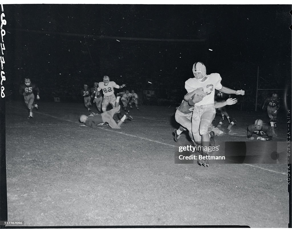 Football Players Running with the Ball