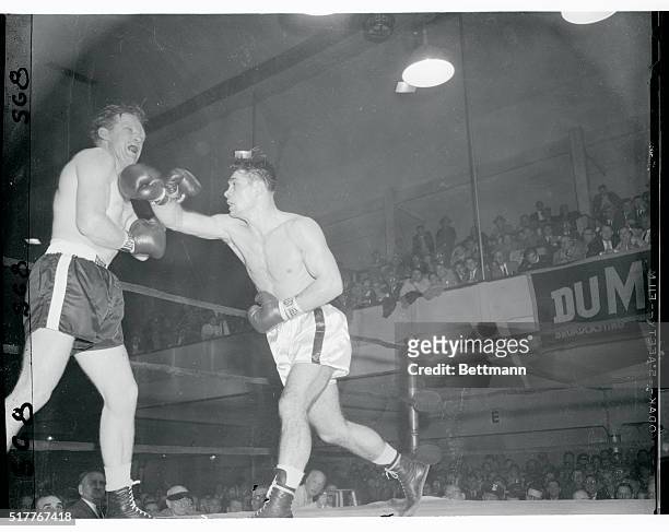 Tony Johnson bounces a hard right off the chin of Billy McNeece in the second round of their return bout at St. Nick's Arena tonight. Johnson, a...