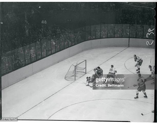 Ranger Goalie Makes a Save. New York: Ranger goalie Lorne Worsley protects the goal with his body as he falls to the ice in the second period of...