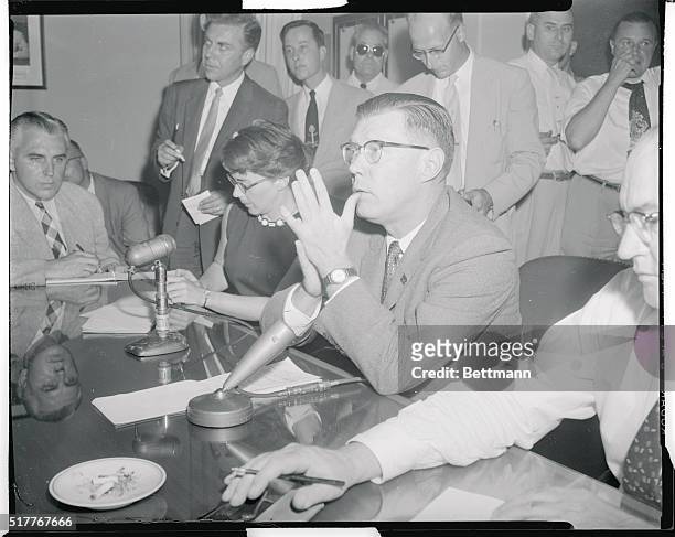 Washington, D.C.: White House news secretary James C. Hagerty, shown with Col. Robert L. Schulz, military aide to the president, tells a 5 p.m. Press...