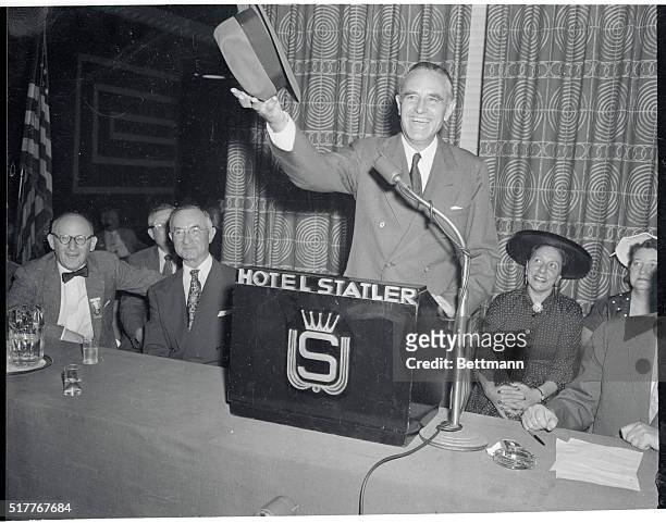 "This hat is in the ring" -- Harriman. New York, New York: Governor W. Averell Harriman of New York is shown as he literally scaled his fedora into...